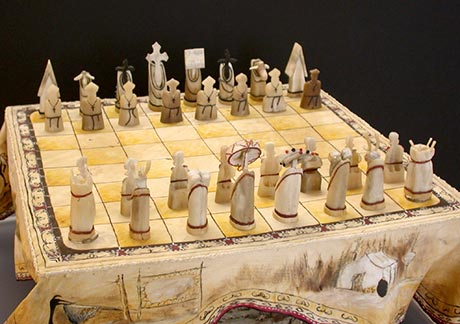 Chess set : Ivory, antler tines, smoked hide, thread, beads, acrylic and wood