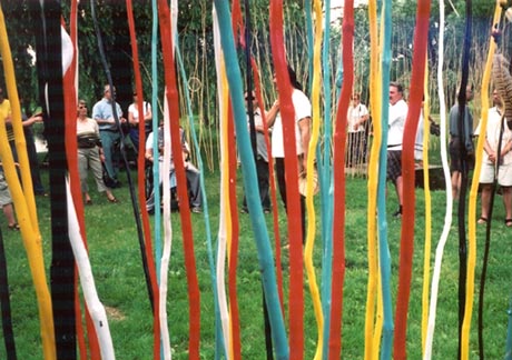 This performance took place on June 21st, National Aboriginal Day, at the First Nations Garden. Jacques N�washish organised a greenspace by planting hundreds of wooden poles whose dimensions were approximately ten feet tall by one or two inches in circumference. These were painted in the colours of the four directions; yellow, red, black and white. In the photo, we see Jacques speaking to the participants.