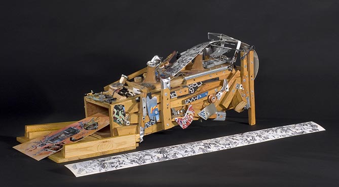 Machine � explorer les signes est une sculpture fantaisiste faites de pi�ces de bois trouv�es et de multiples bouts de m�tal peints. La sculpture figure son propre mode d'�laboration. Une longue bande �troite, orn�e de dessins hopi et navajo est introduite � l'une des extr�mit�s de la machine. Puis, � l'extr�mit� oppos�e, un collage contemporain ach�ve d'�tre compl�t� par la machine. L'artiste ironise ici sur les processus d'appropriation, pratiques courantes de l'art d'aujourd'hui.